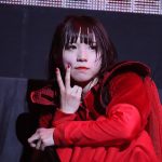 AYUNi D in red costume during the live in Osaka Jo Hall