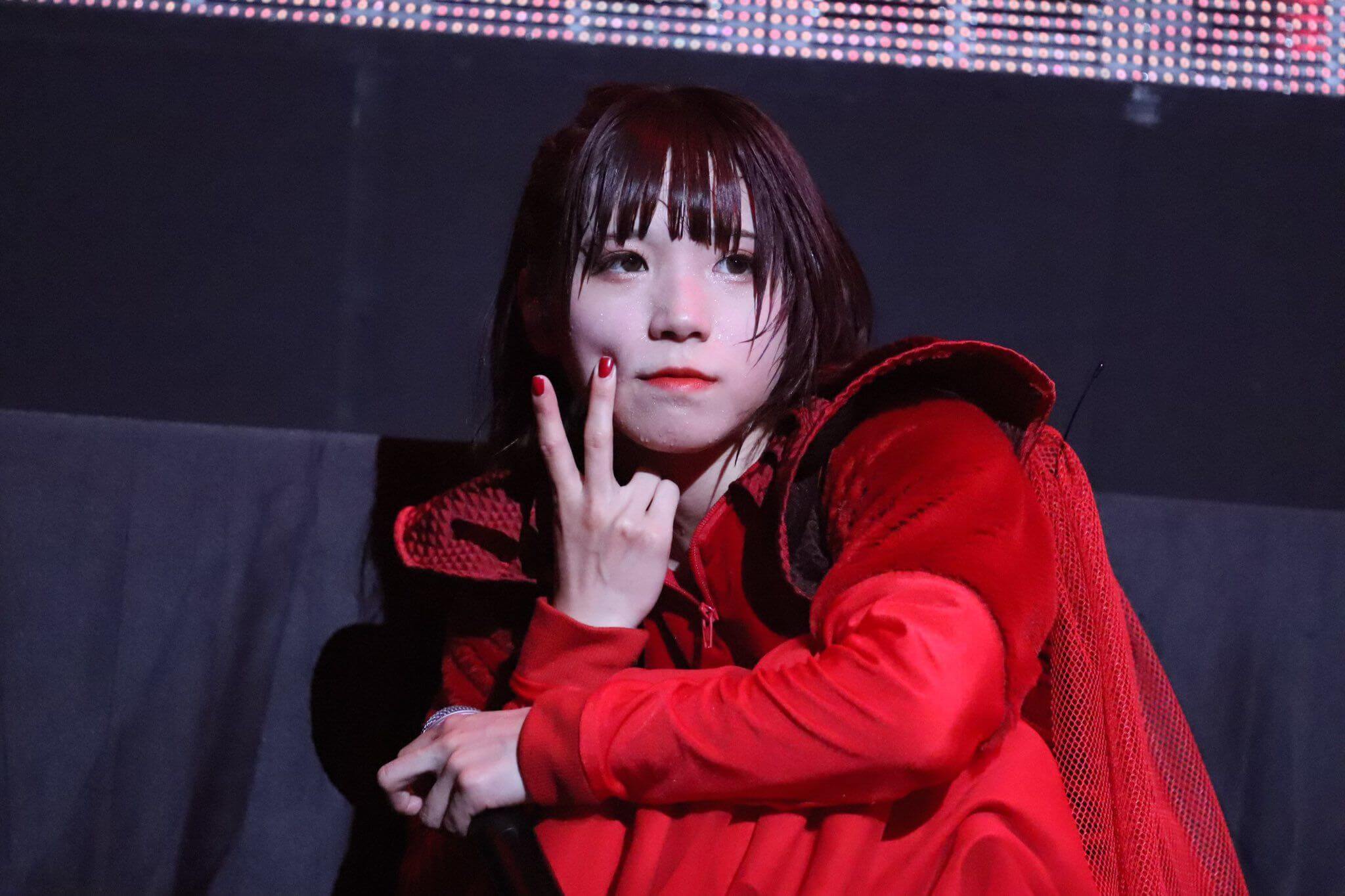 AYUNi D in red costume during the live in Osaka Jo Hall